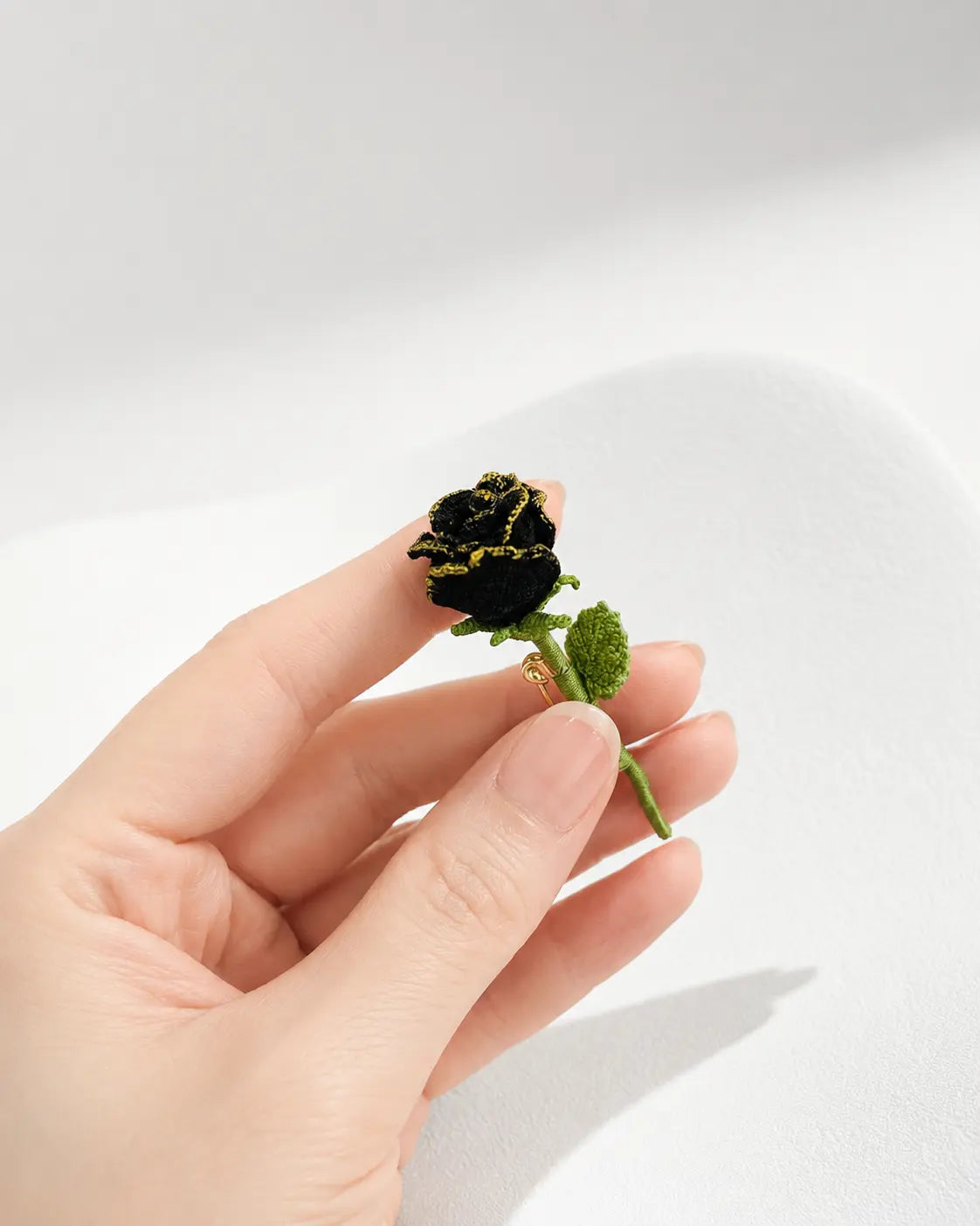 Gold-Trimmed Black Rose Brooch