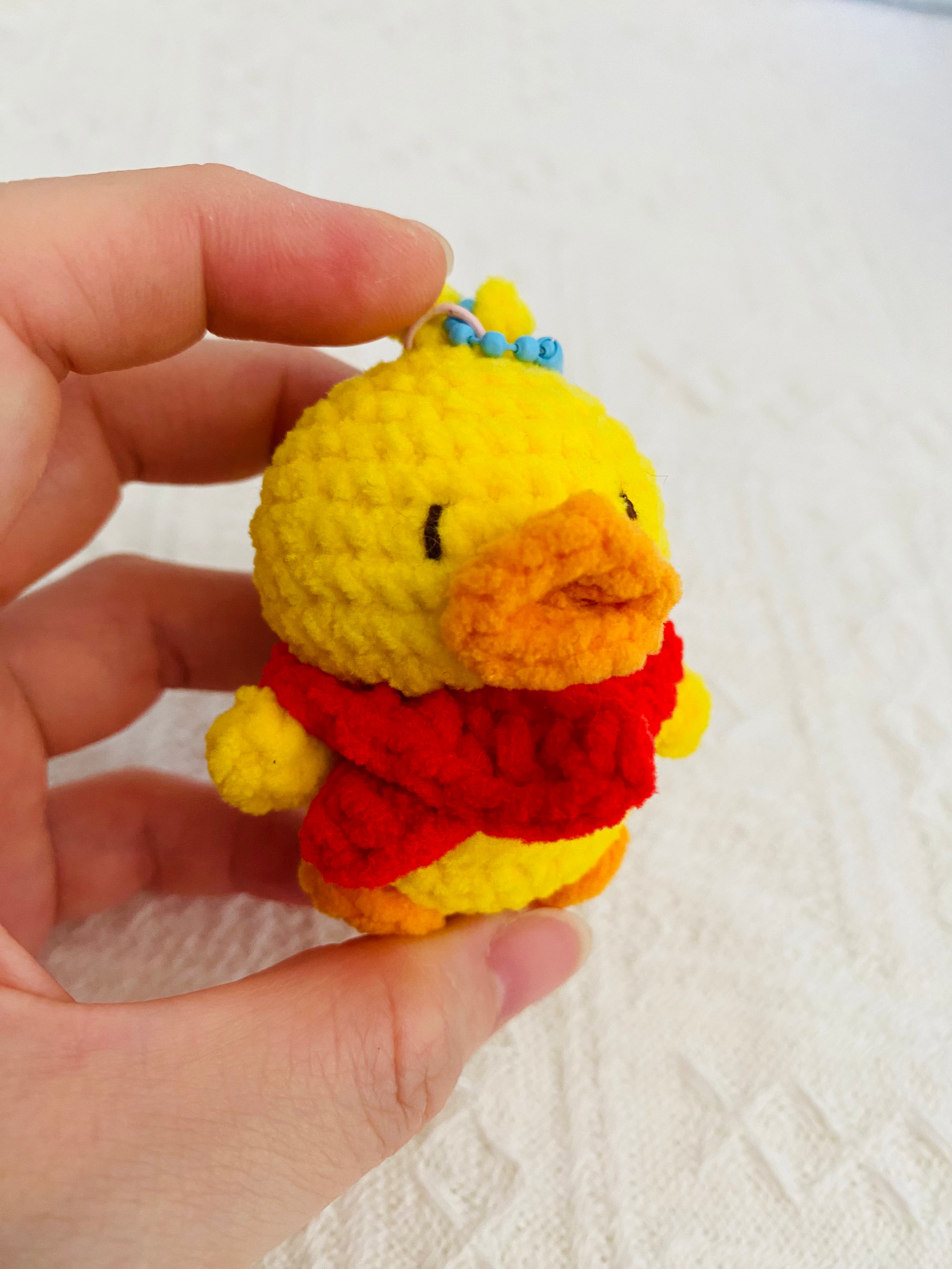 Crochet duck bag charm, handmade yellow duck keychain on backpack