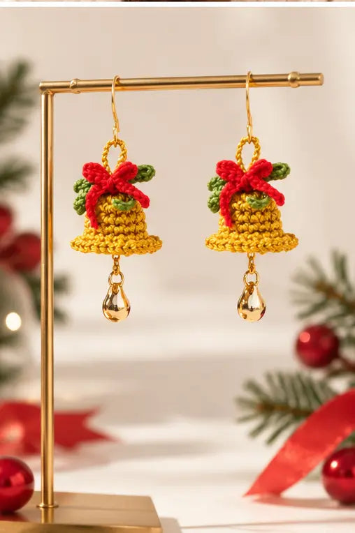 Christmas bell bow earrings styled in a festive holiday setting