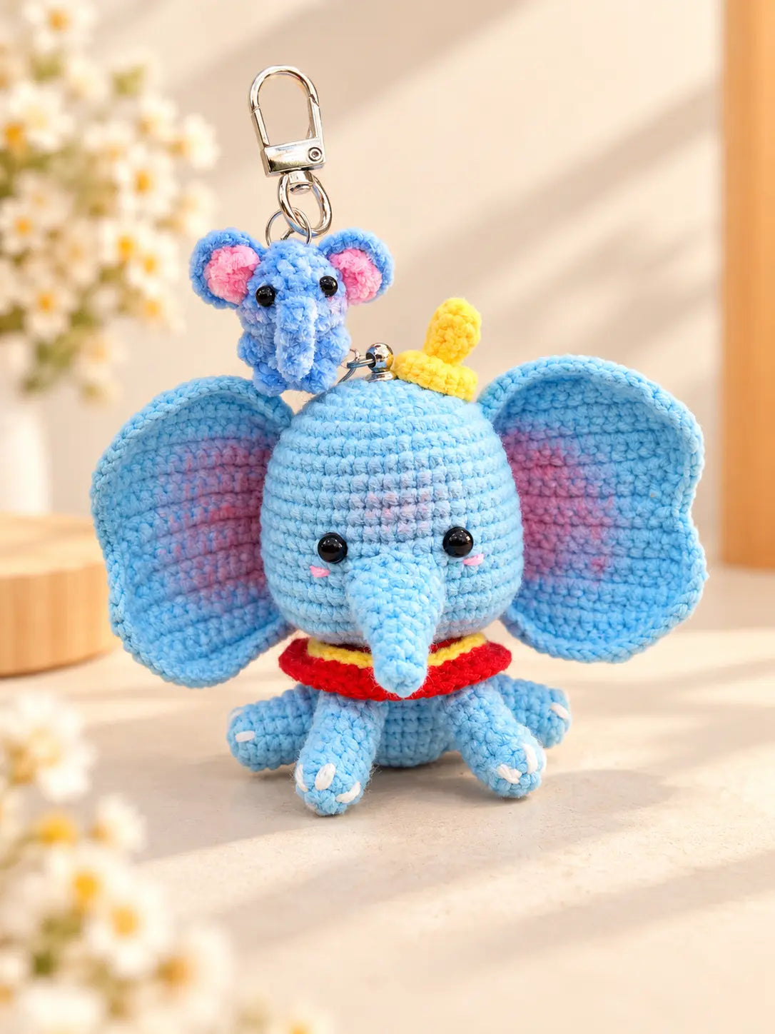 Collection of two handmade crochet elephant keychains and bag charms in different blue elephant designs