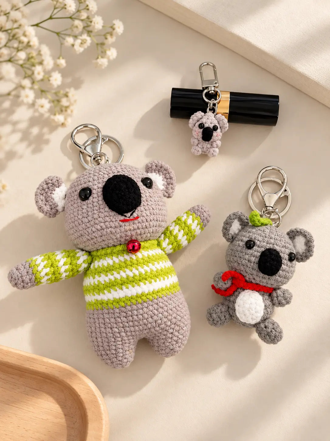 collection.webp	Collection of handmade crochet koala keychains in different sizes, including a mini koala and a larger koala wearing a green striped sweater.