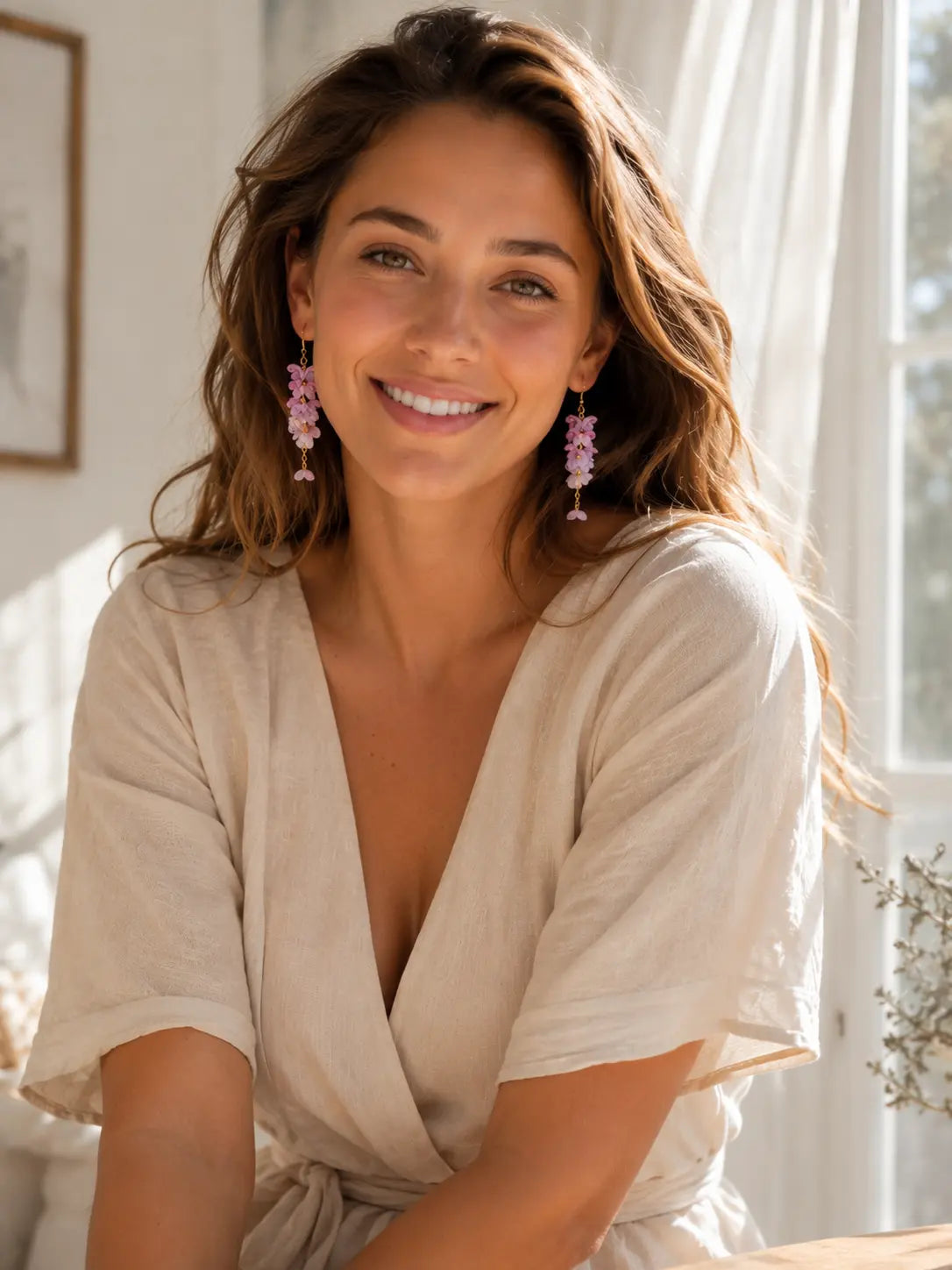 Smiling woman wearing purple micro crochet floral drop earrings indoors