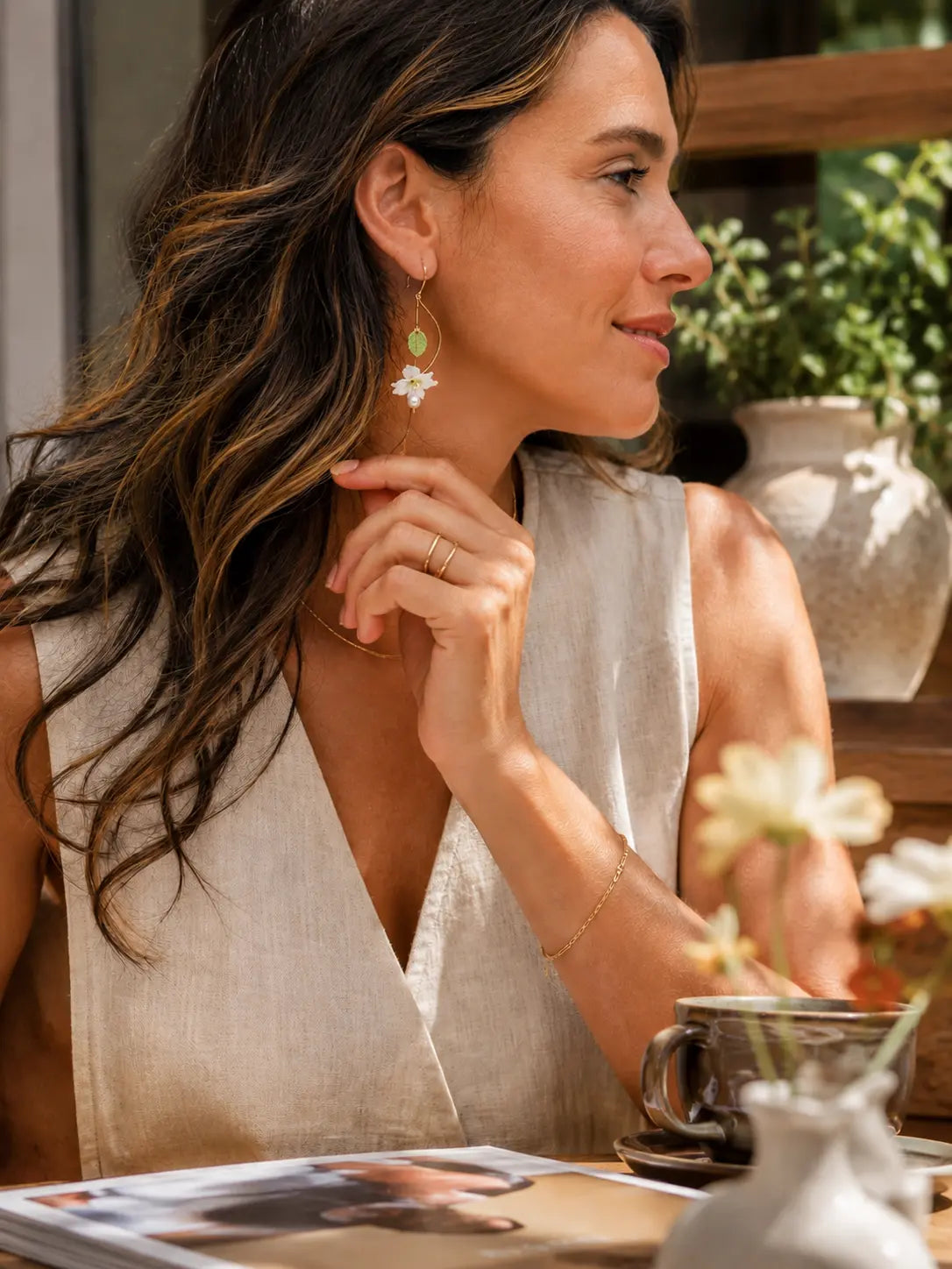 Lily & Freshwater Pearl Spiral Earrings worn with a neutral summer outfit