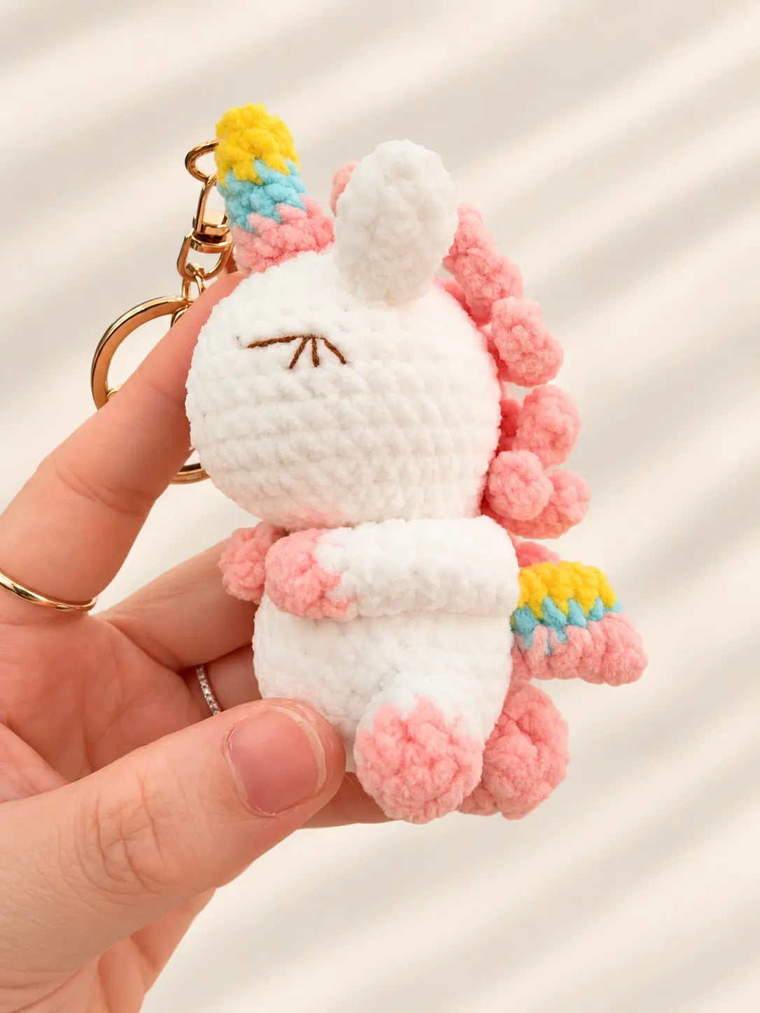 Handmade crochet unicorn keyring and bag charm close-up