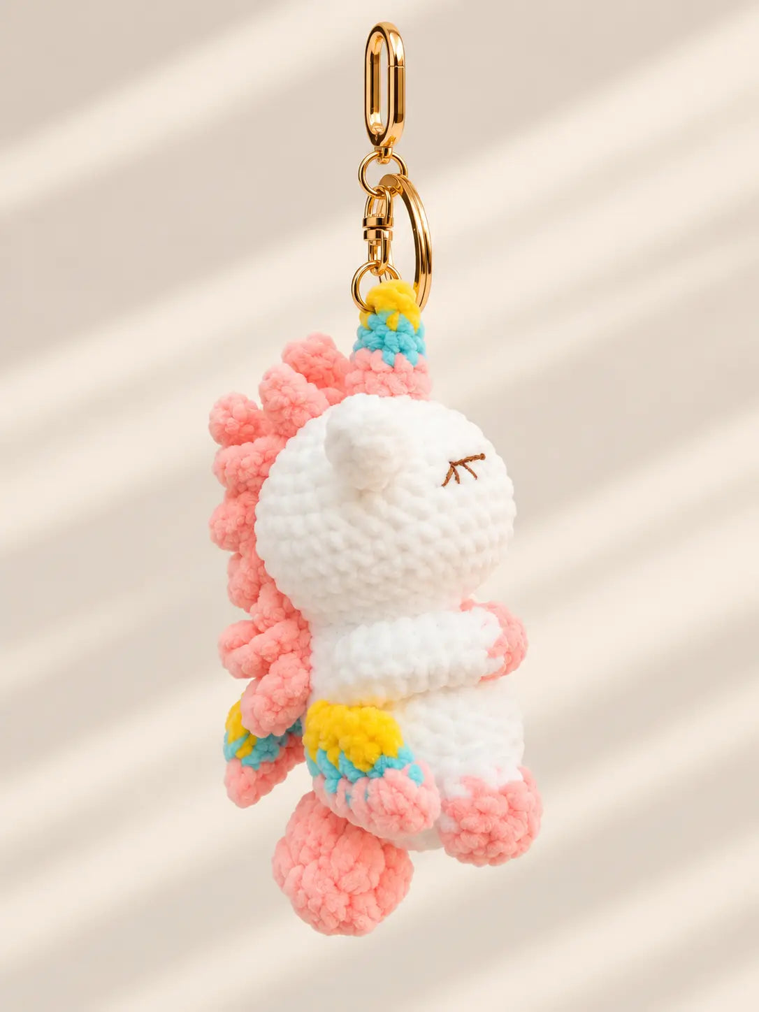 Handmade crochet unicorn keyring and bag charm side view